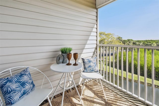 balcony featuring a water view