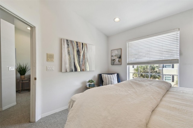 bedroom with vaulted ceiling, recessed lighting, carpet flooring, and baseboards
