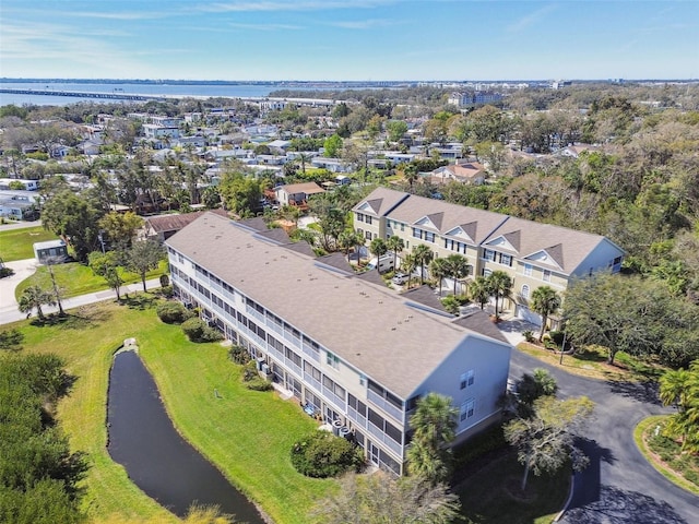 bird's eye view featuring a water view and a residential view