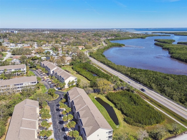 bird's eye view featuring a water view and a residential view