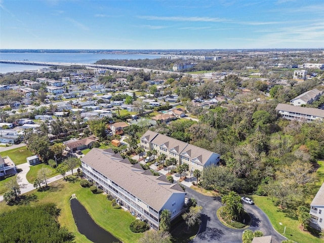 drone / aerial view with a water view and a residential view