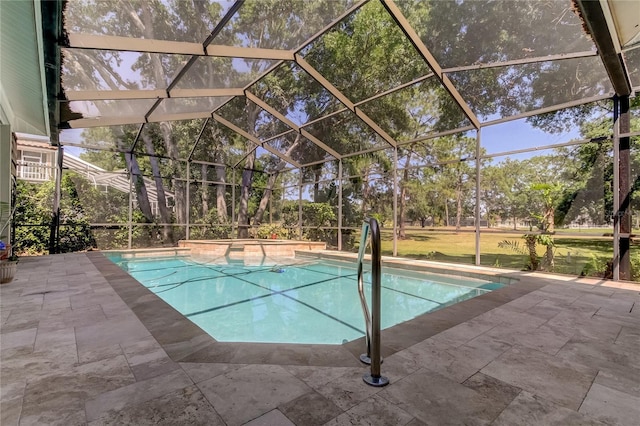 outdoor pool featuring a lanai, a patio area, and a jacuzzi