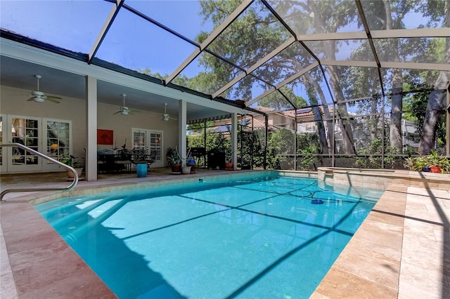outdoor pool with a patio, french doors, glass enclosure, and a ceiling fan