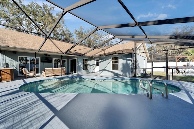 view of pool featuring a ceiling fan, a lanai, a patio, and a fenced in pool