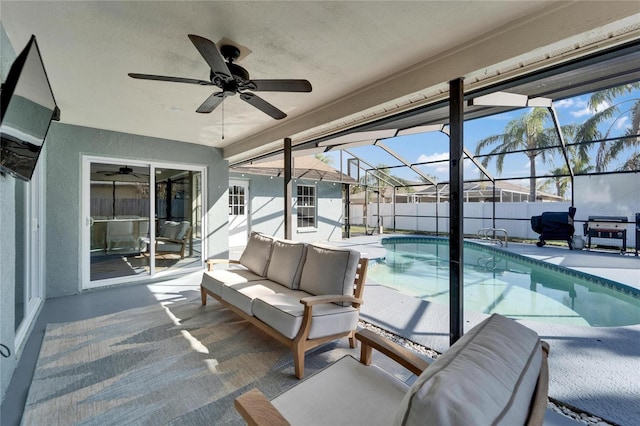 view of swimming pool with a patio, a lanai, an outdoor hangout area, fence, and a fenced in pool