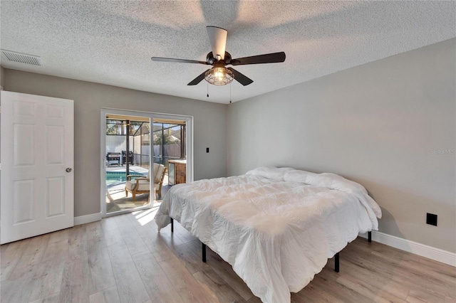 bedroom featuring access to exterior, baseboards, visible vents, and light wood finished floors