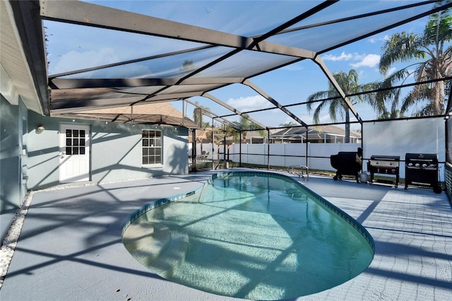 view of pool featuring a fenced in pool, grilling area, a patio area, fence, and a lanai