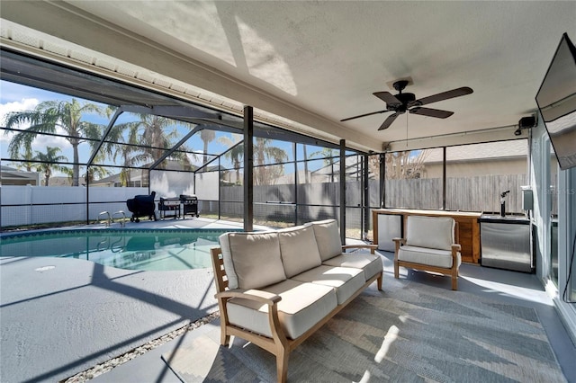 sunroom / solarium with ceiling fan