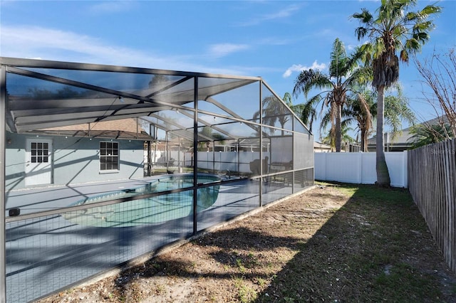 view of tennis court featuring a patio area, a fenced backyard, and a fenced in pool