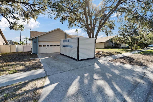 exterior space with fence and driveway