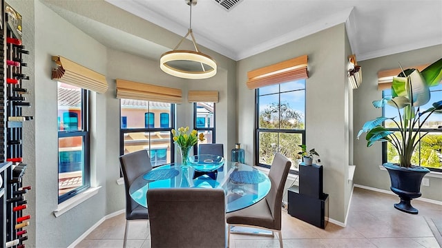 dining room featuring crown molding, visible vents, and baseboards