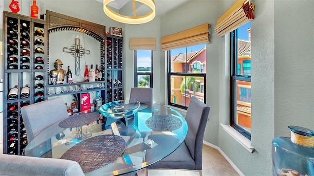 wine cellar with light tile patterned floors and baseboards