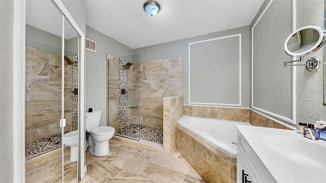 bathroom with toilet, visible vents, vanity, a bath, and a stall shower