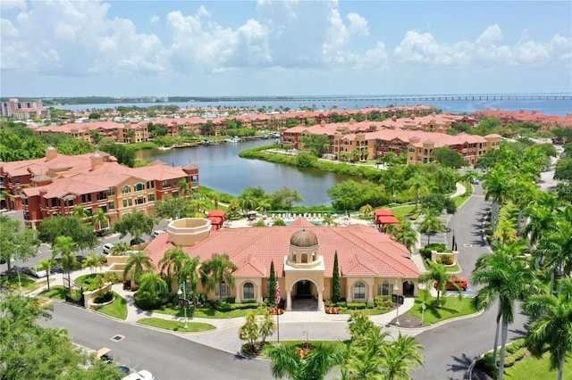 bird's eye view with a water view and a residential view