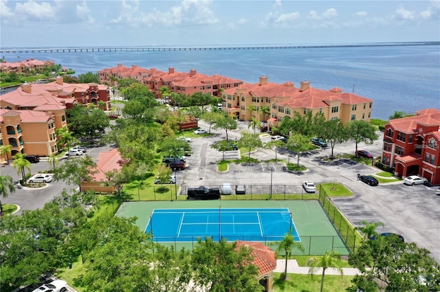 drone / aerial view featuring a water view and a residential view