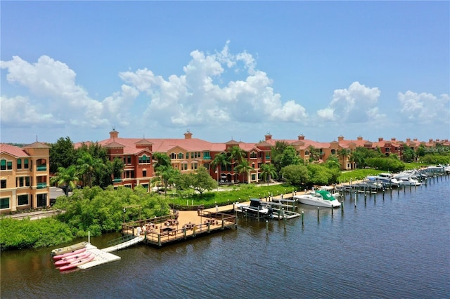 property view of water featuring a residential view and a boat dock