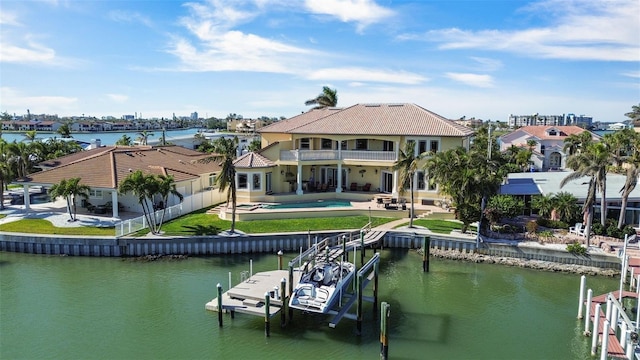 view of dock with a patio, boat lift, a balcony, a water view, and a fenced in pool