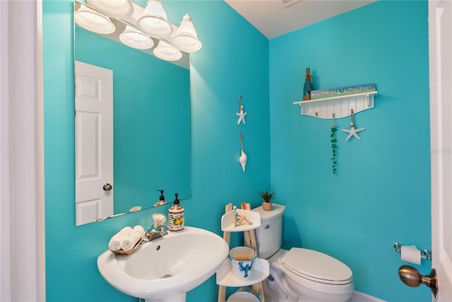 bathroom featuring a sink and toilet