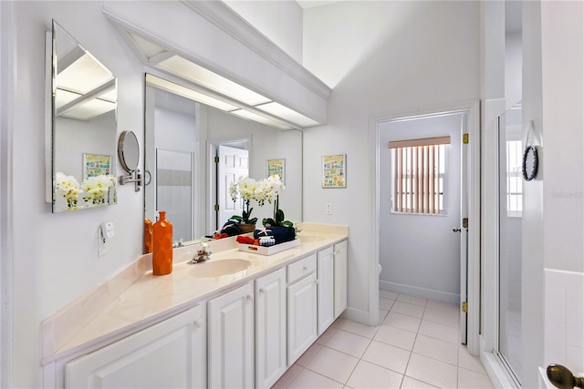 full bathroom with a stall shower, baseboards, toilet, tile patterned flooring, and vanity