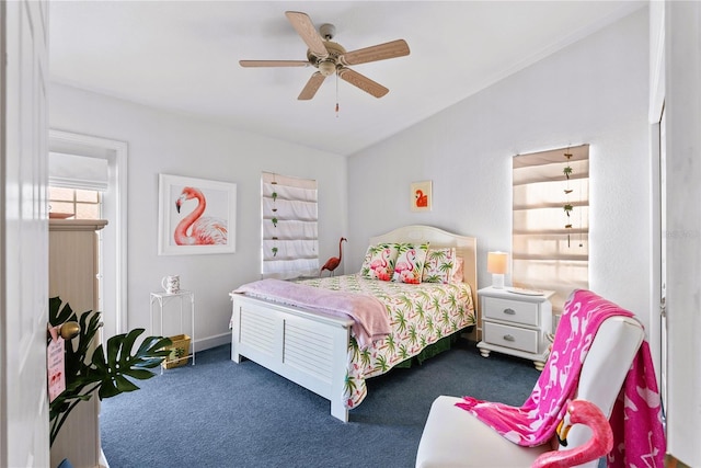 bedroom featuring a ceiling fan, carpet, and vaulted ceiling