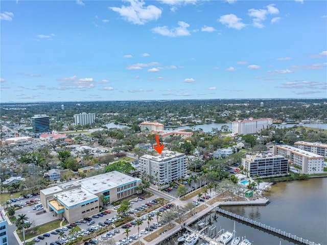 drone / aerial view featuring a view of city and a water view