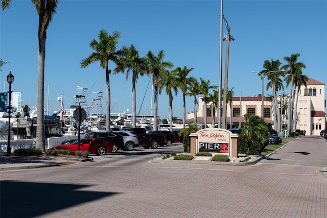 view of street with sidewalks, street lights, and curbs