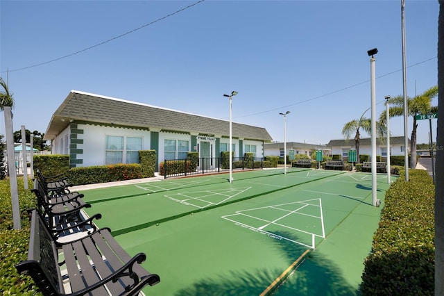 view of home's community featuring shuffleboard