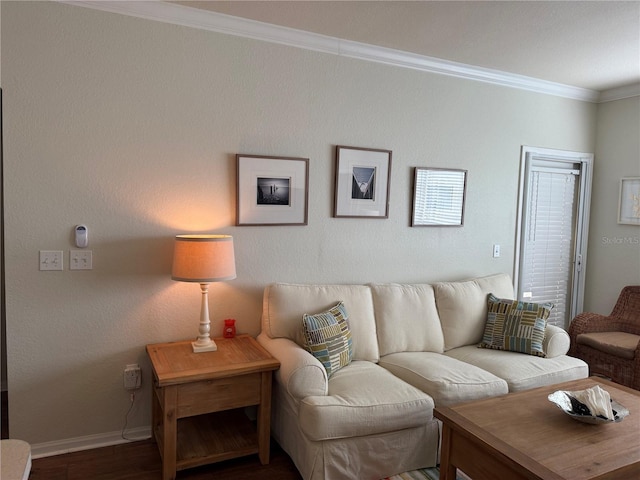 living room with baseboards, wood finished floors, and crown molding