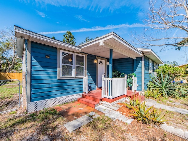 single story home featuring fence