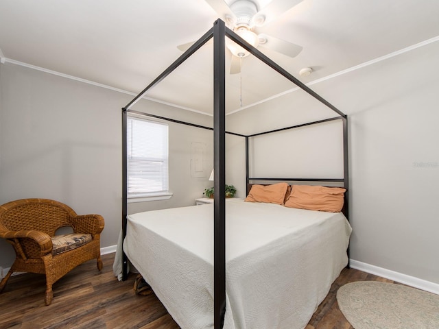 bedroom featuring dark wood-style floors, crown molding, baseboards, and ceiling fan