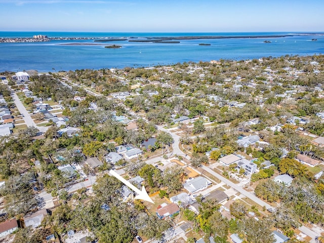 drone / aerial view featuring a residential view and a water view