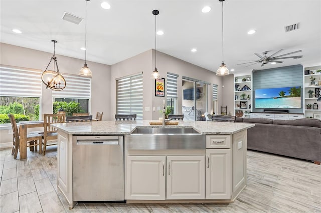 kitchen featuring white cabinets, visible vents, a sink, and stainless steel dishwasher