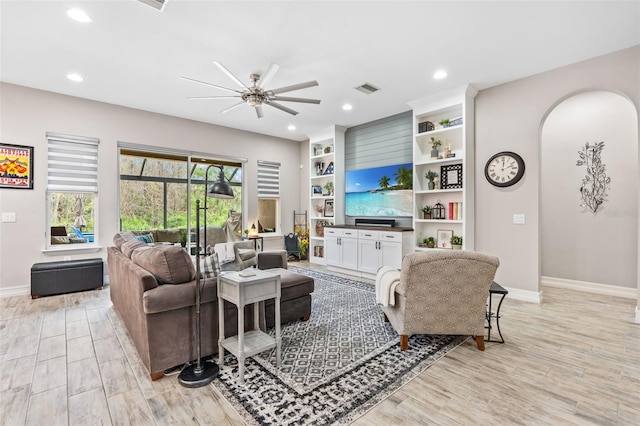 living area with ceiling fan, recessed lighting, visible vents, baseboards, and light wood finished floors