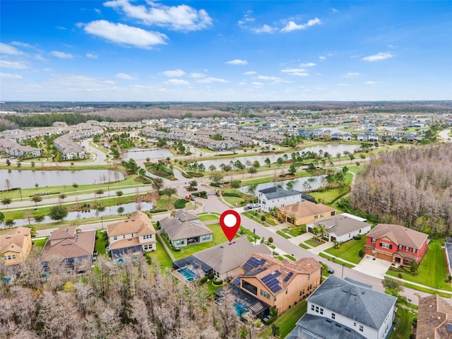 birds eye view of property with a water view and a residential view