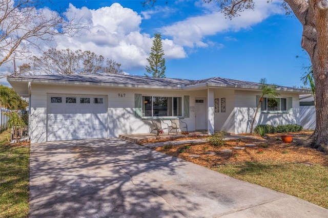 single story home with an attached garage and concrete driveway