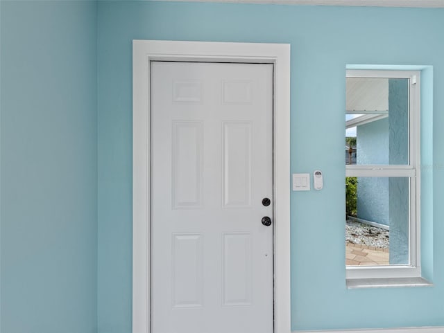 doorway to property with stucco siding