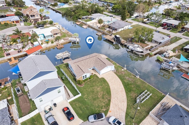 bird's eye view with a water view and a residential view