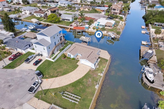 aerial view with a residential view and a water view