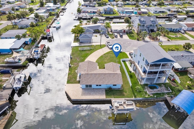 bird's eye view featuring a water view and a residential view