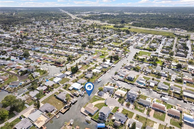 birds eye view of property with a residential view