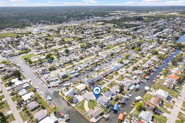 aerial view featuring a residential view and a water view