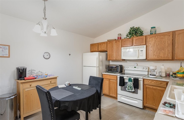 kitchen with white appliances, a toaster, vaulted ceiling, light countertops, and a notable chandelier