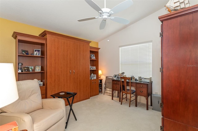 office space with lofted ceiling, light carpet, and ceiling fan