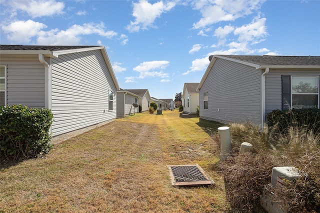 view of side of property featuring a lawn