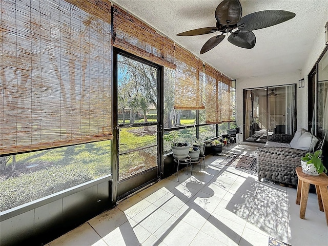 sunroom with ceiling fan and plenty of natural light