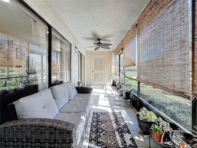 sunroom with a healthy amount of sunlight and a ceiling fan