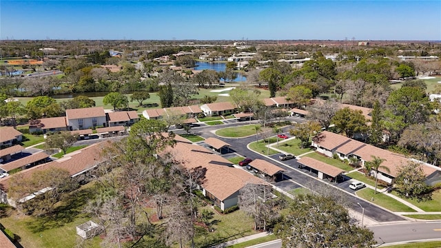 drone / aerial view with a water view and a residential view