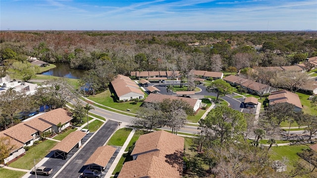 drone / aerial view featuring a residential view and a water view