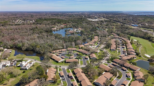 birds eye view of property with a residential view and a water view