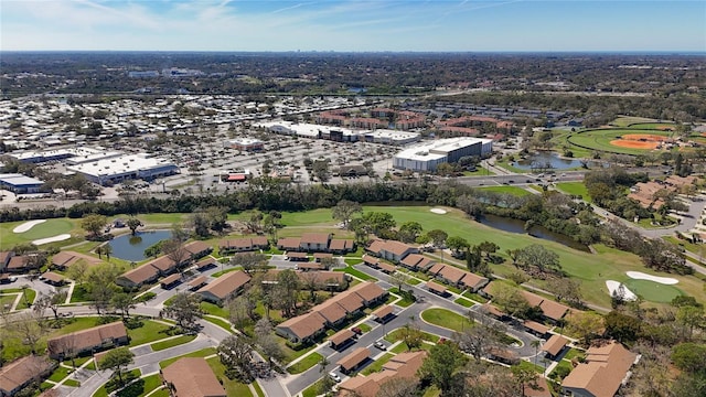 aerial view featuring a water view and golf course view